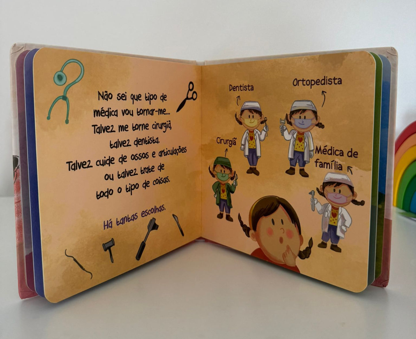 Open children's book with illustrations and text on a white background